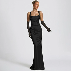 Detail of elegant black satin evening gown with corset waist and chic matching long gloves