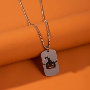 Detailed view of silver stainless steel dog tag necklace with Halloween pumpkin pendant