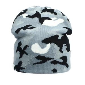 Detail of gray camo knit beanie showing thick warm texture for winter sports