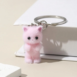 Pink flocked cat keychain with soft plush texture and silver metal ring accessory