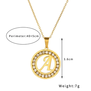 Detail of round golden letter A pendant with sparkling crystals and size measurements