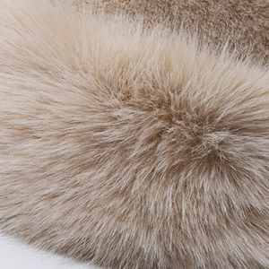 Close-up of thick plush faux mink fur material in light brown for winter earflap hats