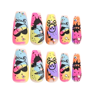 Long coffin press-on nails with colorful graffiti, skull patterns and rhinestones