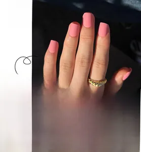 Detail of matte pink press-on nails in short square shape with 24pcs kit set