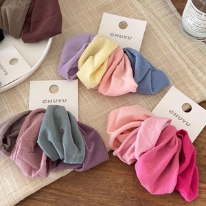 Detail of high-elasticity wide seamless hair ties in assorted soft fabric colors