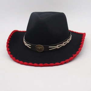 Black Western cowboy felt hat with red woven trim and vintage metal bull head emblem