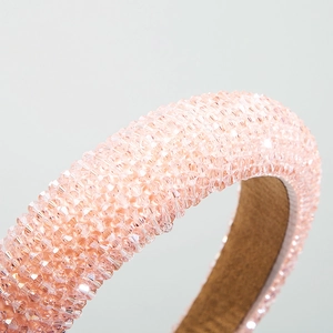 Detail of light pink crystal padded headband showing shiny beads and anti-slip lining