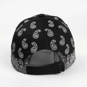 Retro paisley baseball cap in black with white patterns and adjustable velcro strap