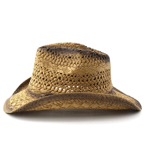 Detail of hand-woven straw hat showing vintage brown spray-painted edges and texture