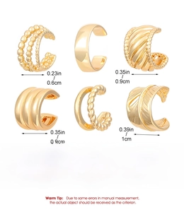 Detailed view of six gold copper ear cuffs with assorted textures and precise dimensions