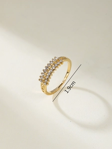 Macro detail of gold ring with heart cutouts and 1.9cm inner diameter measurement