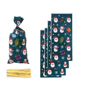 Detail of Christmas candy bags with Santa patterns, snowmen and golden twist ties