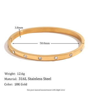 Polished 18K gold-plated stainless steel bangle with circular cubic zirconia inlay