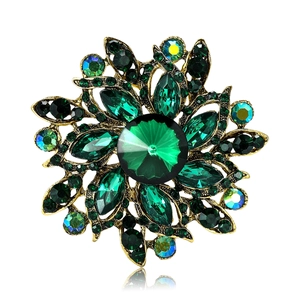 Elegant emerald green crystal flower brooch with gold alloy base and sparkling rhinestones