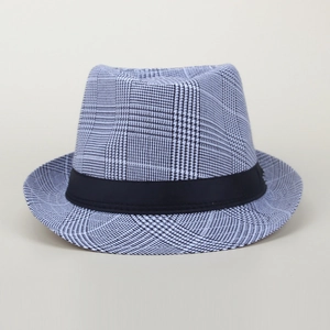 Close-up of black and white houndstooth pattern and ribbon on this classic fedora hat