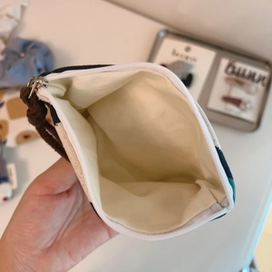 Detailed view of internal lining and zipper pocket of small cotton linen storage bag
