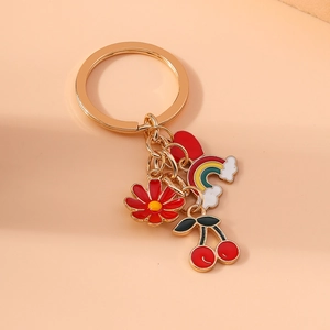 Cute golden alloy keychain with enamel flower, rainbow cloud, and cherry pendants