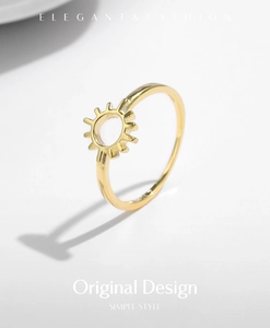 Detailed view of s925 sterling silver sun ring with minimalist hollow golden design