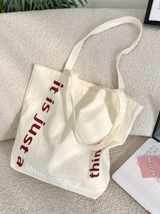Sac fourre-tout minimaliste en toile avec slogan pour le shopping quotidien
