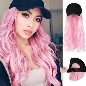 Detail view of pink wavy long hair attached to a black baseball cap wig for women