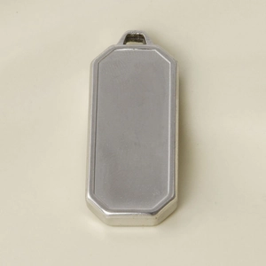 Close-up of polished silver octagonal stainless steel rectangle pendant for DIY jewelry