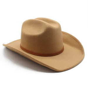 Detailed close-up of a camel felt cowboy hat featuring a brown leather decorative band