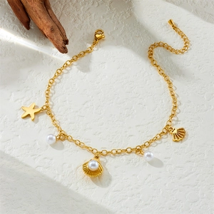 Gold plated stainless steel beach anklet with starfish and pearl shell charms