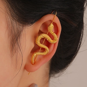 Golden snake crawler earring with detailed scale texture in a punk minimalist style