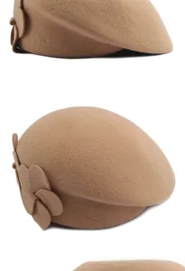 Detail view of camel wool beret showing elegant 3D floral accent and fine wool texture