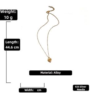 Detail view of golden heart pendant necklace with length and weight specifications