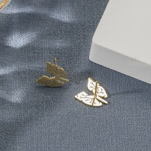 Golden leaf-shaped stainless steel stud earrings featuring realistic vein textures