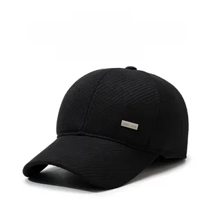 Detail of wool baseball cap with ear flaps and BEST 1988 metal plate for men