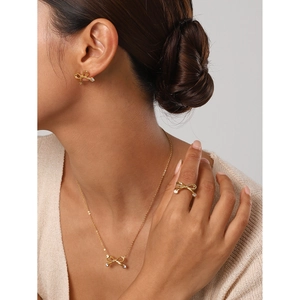 18k gold plated stainless steel bow jewelry set with sparkling cubic zirconia accents