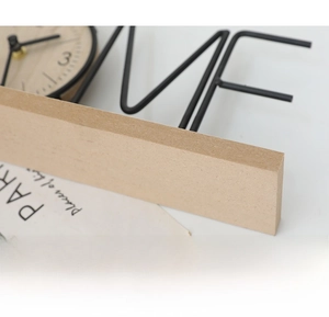 Close-up of the thick solid wood base providing stable support for the desk clock