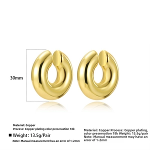 Detailed view of twisted C-shaped earrings in 18k gold plating with 30mm height and weight