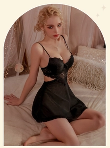Close-up of black lace babydoll nightdress with intricate embroidery and sheer mesh detail