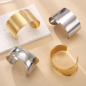 Minimalist 18k gold plated stainless steel open bangles in smooth and textured finishes