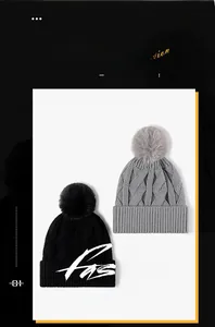 Detail of warm knitted beanie hats in black and gray featuring soft faux fur pom-poms
