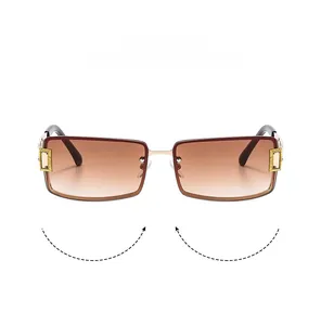 Detail of square rimless sunglasses with gold metal hinges and gradient brown lenses