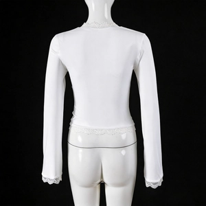 Back view detail of white slim long sleeve top with delicate lace trim on hem and sleeves
