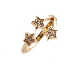 Detail of adjustable gold ring with three stars pavé-set with shimmering zircon stones