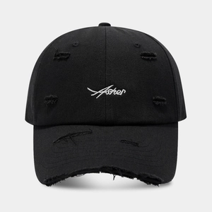 Detail of black distressed baseball cap with white Asher cursive embroidery and frayed holes
