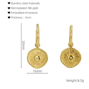 Detail view of 18K gold plated stainless steel sunburst earrings with size dimensions