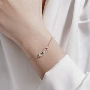 Detail of S925 silver bracelet featuring interlocking oval rings with cubic zirconia
