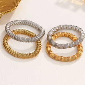 Chic twisted metal bangle bracelets in gold and silver plating for trendy women