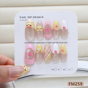Handmade strawberry and cartoon bear French nails set with grid patterns displayed on a card
