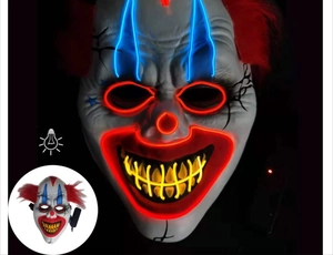 Close-up of LED scary clown mask with blue and red EL wire glowing in the dark