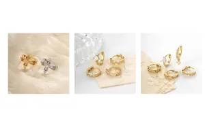Detailed display of vintage cross earrings and round ear cuffs in gold and silver