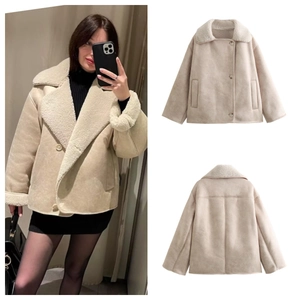 Detail of beige faux shearling jacket showing the collar, front and back layout