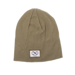Detail of knitted beanie in khaki featuring a white patch with infinity symbol and text
